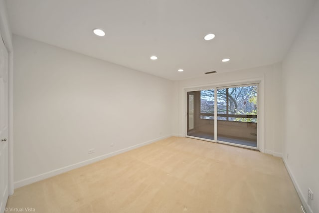 empty room featuring light colored carpet