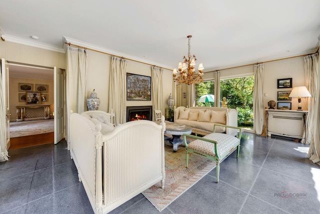 living room with ornamental molding and a chandelier