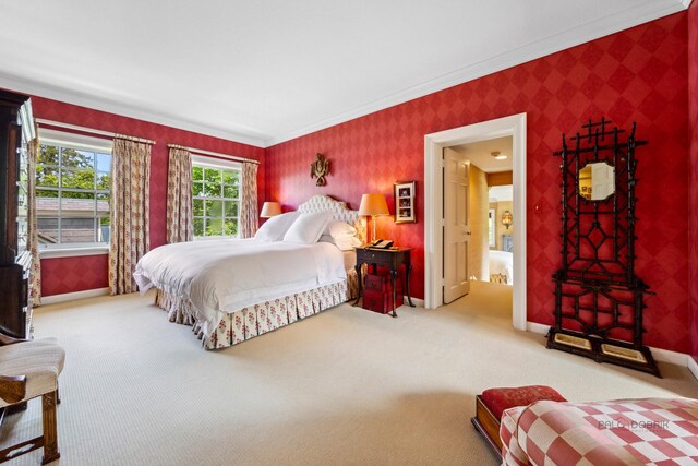 bedroom featuring ornamental molding and carpet