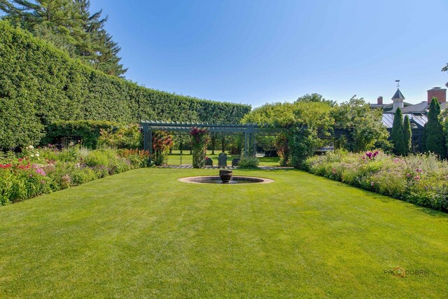 view of yard with a pergola