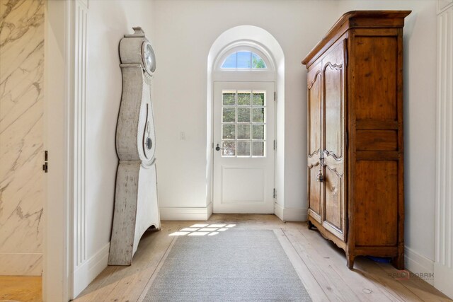 doorway to outside featuring light hardwood / wood-style floors