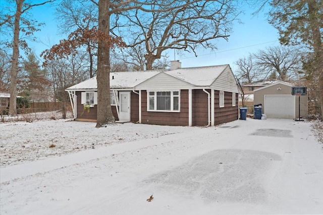 view of front of house featuring an outdoor structure and a garage