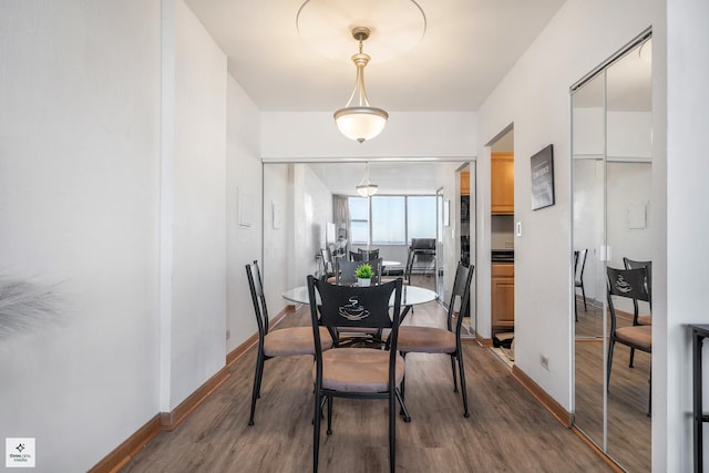 dining area featuring hardwood / wood-style flooring