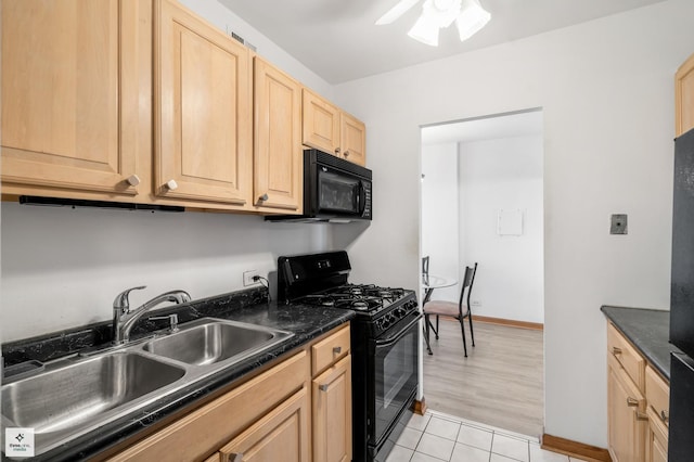 kitchen featuring ceiling fan, sink, light brown cabinets, light tile patterned floors, and black appliances