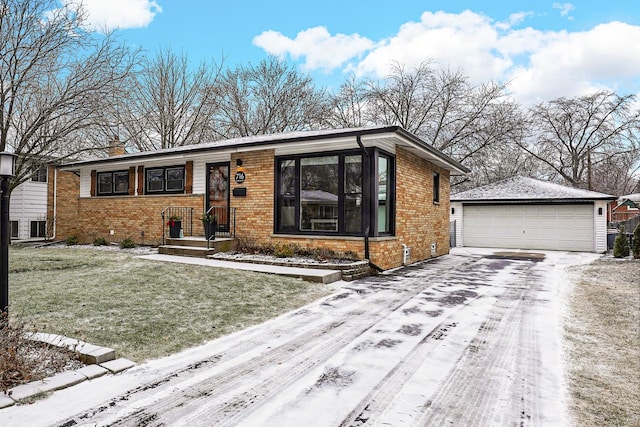 view of front of house with a yard, an outdoor structure, and a garage