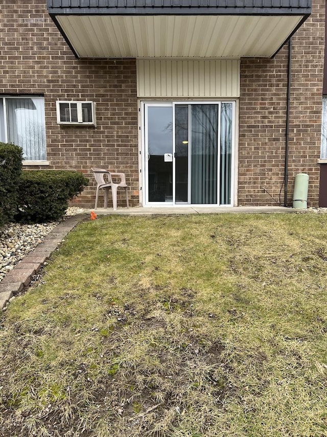 rear view of property with a yard