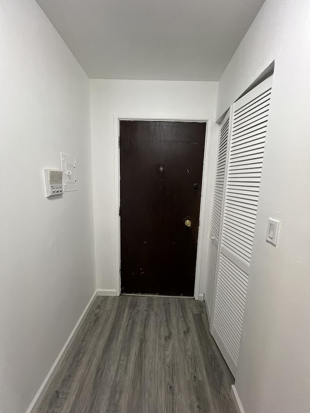 hall with dark hardwood / wood-style floors