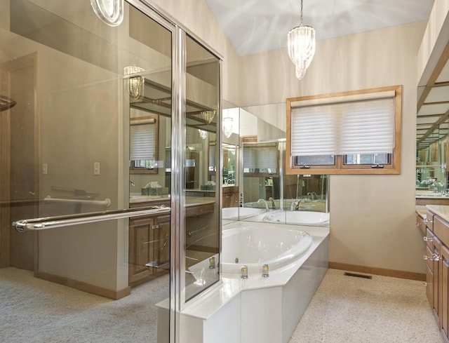 bathroom with vanity and independent shower and bath