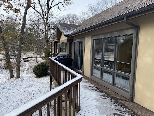 view of snow covered deck