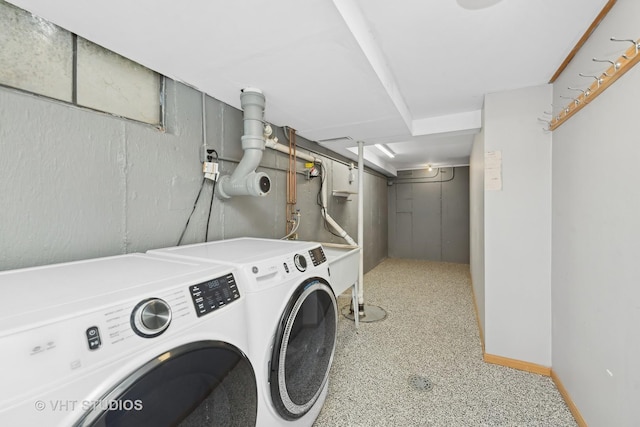 clothes washing area with independent washer and dryer