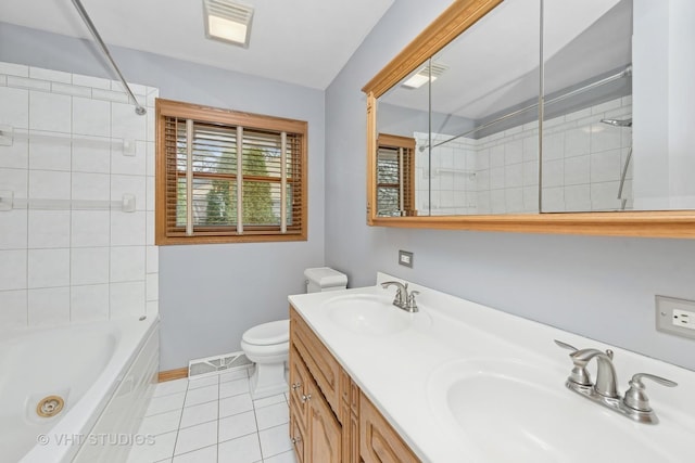 full bathroom with tile patterned flooring, vanity, toilet, and tiled shower / bath combo