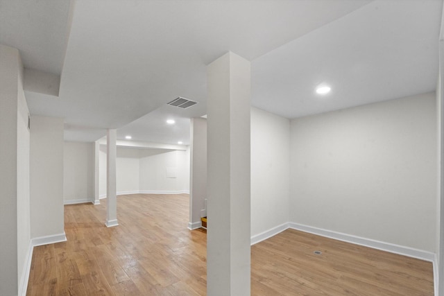 basement featuring wood-type flooring