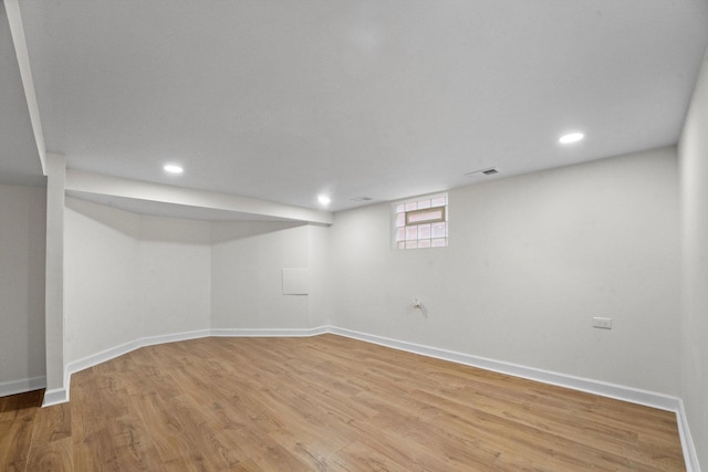 basement featuring light hardwood / wood-style floors