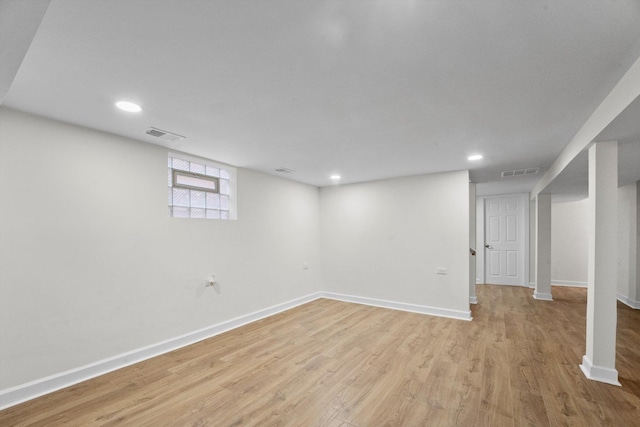 basement featuring light hardwood / wood-style flooring