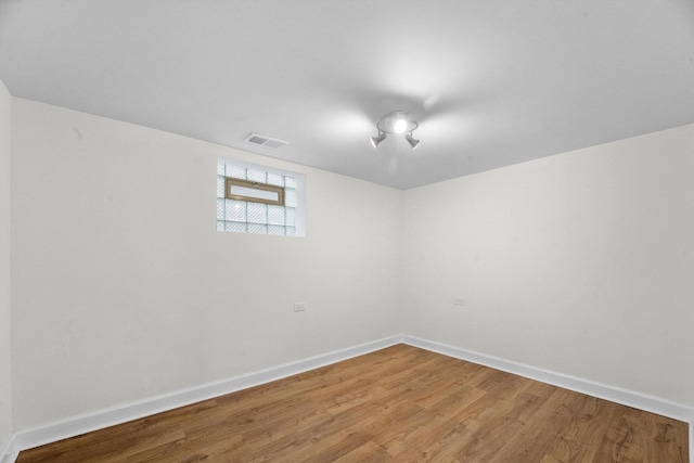 basement featuring hardwood / wood-style flooring