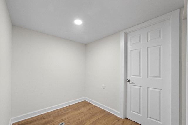 unfurnished room featuring wood-type flooring