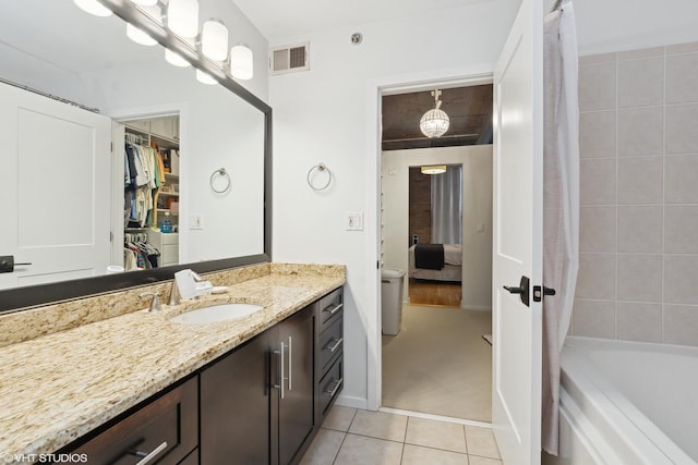 bathroom with tile patterned flooring and vanity