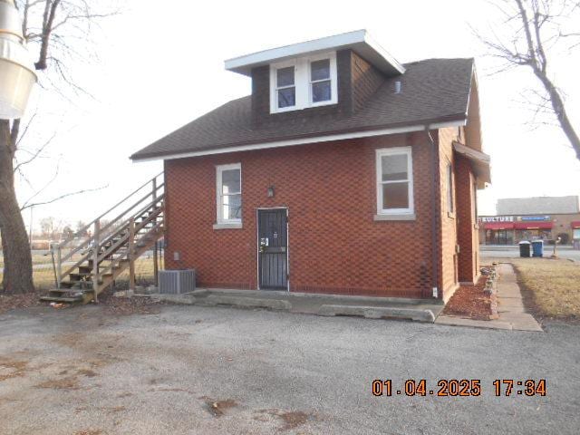 view of property exterior featuring central AC unit