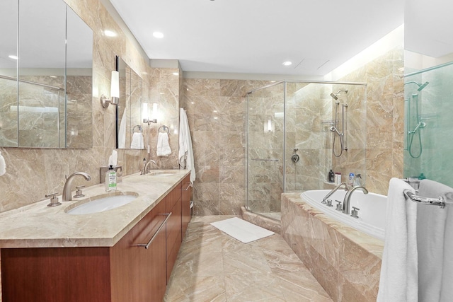 bathroom with plus walk in shower, vanity, and tile walls