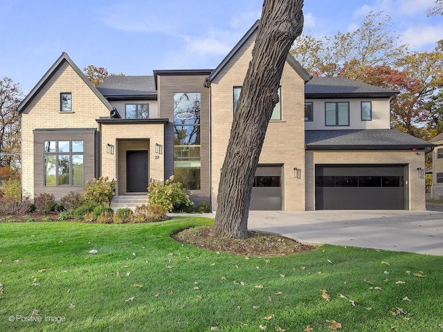 contemporary home with a front lawn and a garage