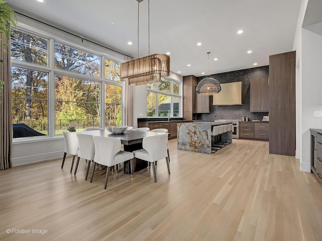 dining area featuring light wood-type flooring