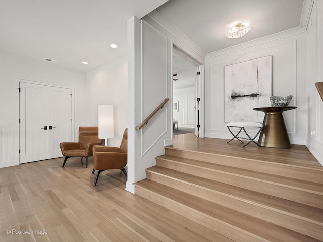 staircase with wood-type flooring