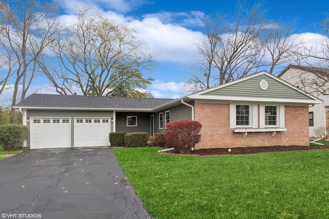 ranch-style house with a front yard and a garage