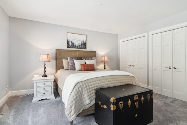 carpeted bedroom with two closets