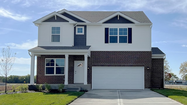 view of front facade featuring a garage and a front lawn