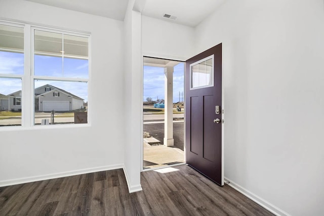 foyer entrance with dark hardwood / wood-style floors