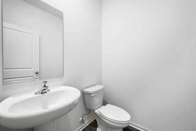 bathroom featuring sink and toilet