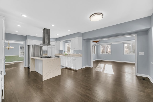 kitchen featuring white cabinets, a center island, island exhaust hood, sink, and dark hardwood / wood-style floors