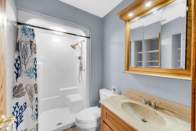 bathroom with vanity, toilet, and curtained shower