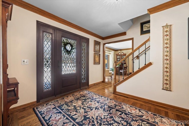 entryway with hardwood / wood-style floors and ornamental molding