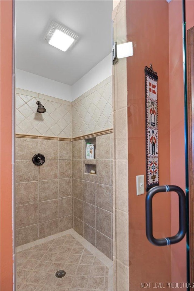 bathroom with a shower with shower door