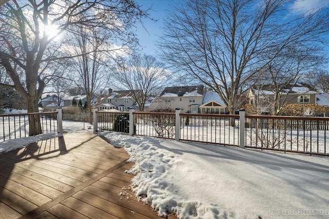 view of snow covered deck