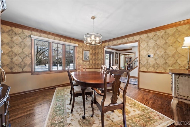 dining space featuring a chandelier, dark wood-type flooring, and crown molding