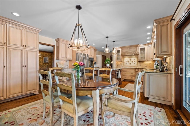 dining room featuring light hardwood / wood-style flooring and an inviting chandelier