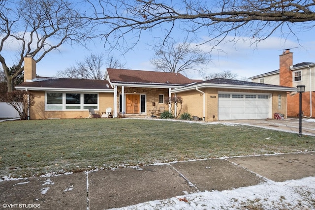 ranch-style home featuring a front yard and a garage