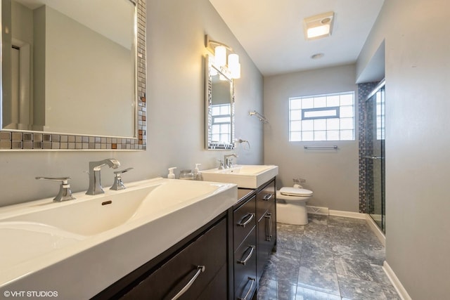 bathroom with vanity, an enclosed shower, and toilet