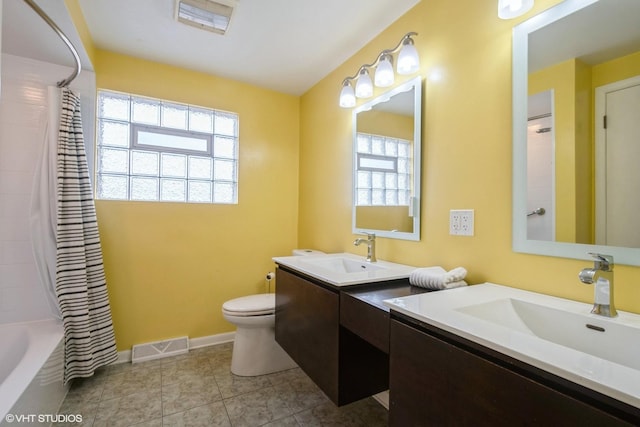 full bathroom featuring toilet, vanity, shower / tub combo with curtain, and tile patterned flooring