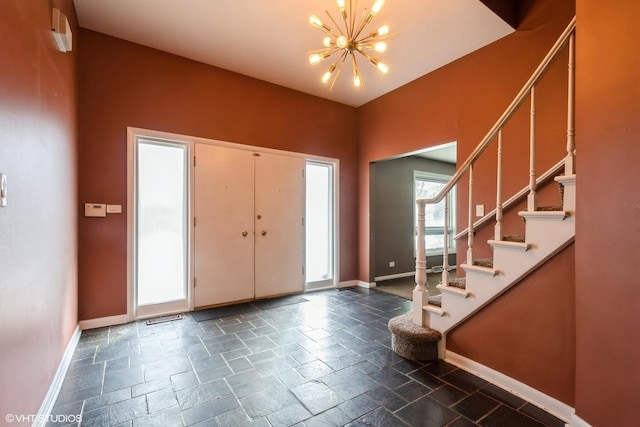 entrance foyer with a notable chandelier