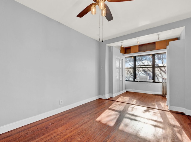 spare room featuring ceiling fan and light hardwood / wood-style floors