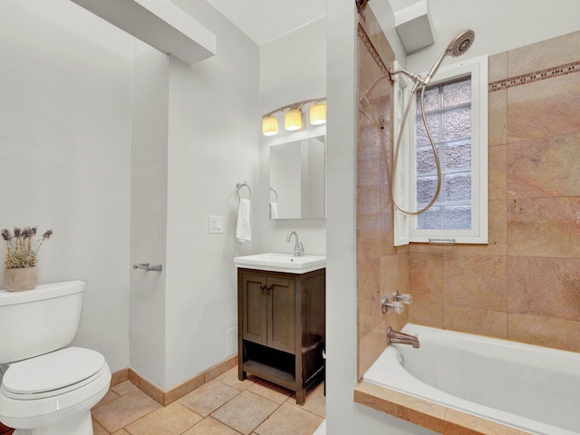 full bathroom featuring toilet, vanity, tile patterned floors, and tiled shower / bath combo