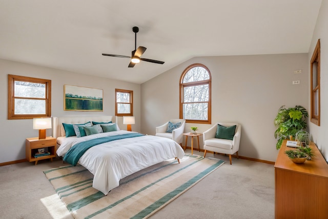 carpeted bedroom with ceiling fan and lofted ceiling