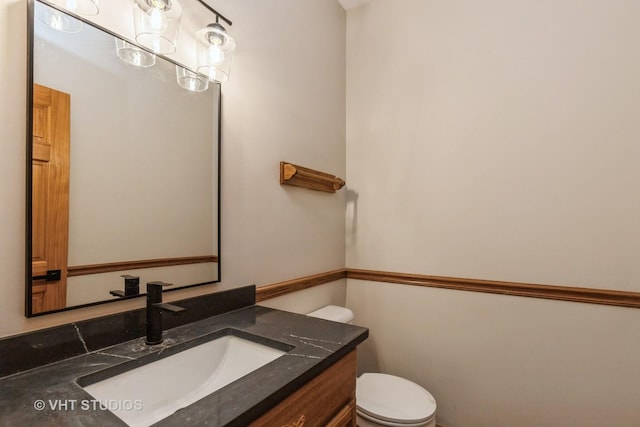 bathroom with vanity and toilet