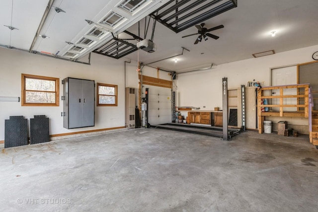 garage with a garage door opener and ceiling fan