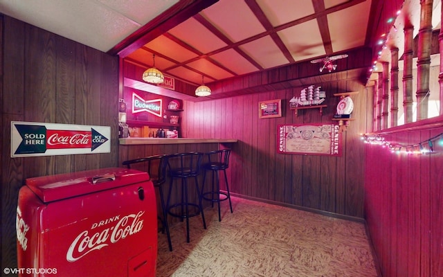 bar featuring wood walls