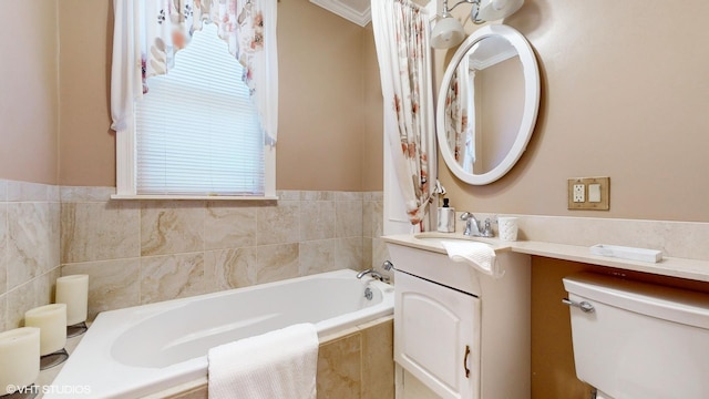 bathroom with vanity, a relaxing tiled tub, toilet, and ornamental molding