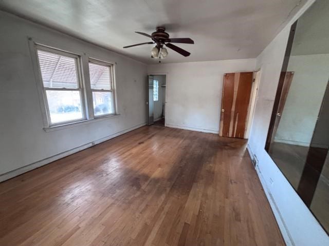 spare room featuring ceiling fan and wood-type flooring